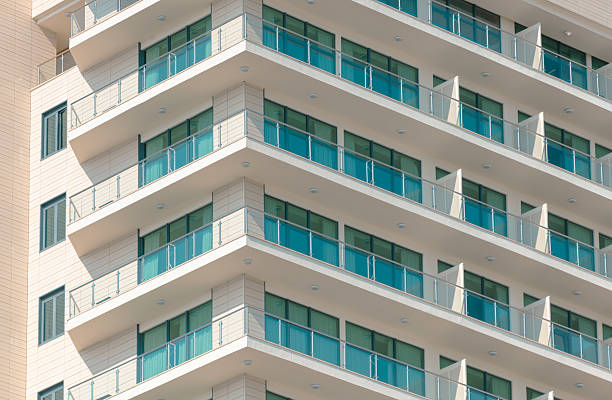 istock A tall building with a lot of windows and balconies 2222836694