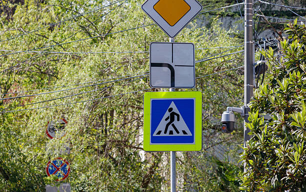 istock A sign with a person walking on it is on a pole 2222837081