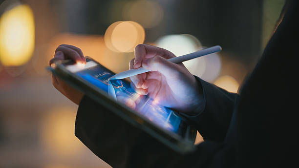 istock hand using smartphone and digital stylus on tablet to review ai-generated financial charts and trading patterns financial data visualization on smart devices for personal investing, stock analysis, and business forecasting 2222837968