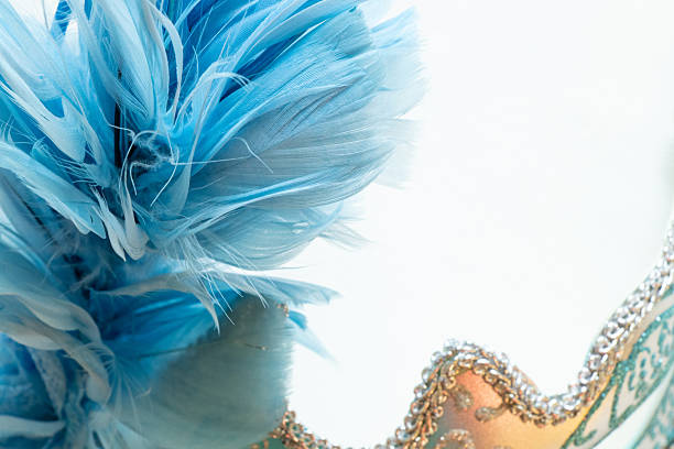 istock Light blue carnival mask with blue and black feathers on a white background, decorative accessory 2222838078