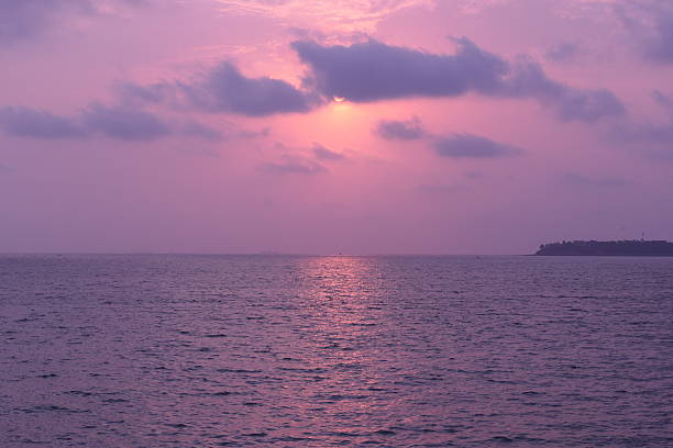Afterglow sunset with purple sky over sea