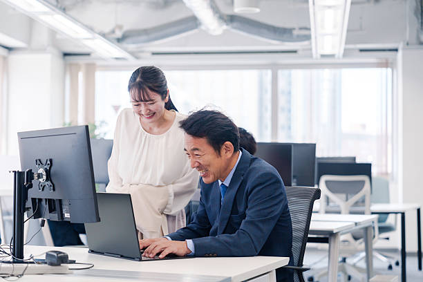 istock Boss and young woman having fun in the office 2222840050