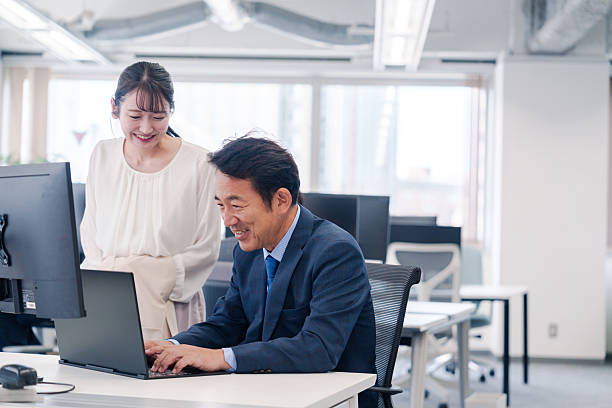 istock Boss and young woman having fun in the office 2222840052