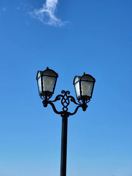 istock Twin iron lanterns against clear sky 2222841919