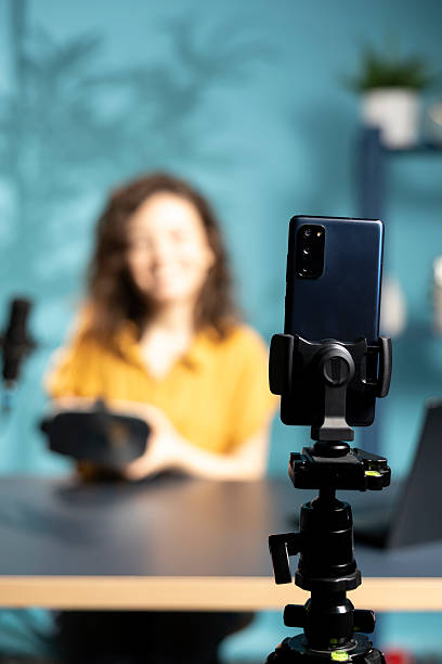 istock Happy tech specialist reviewing futuristic VR goggles in studio 2222843145