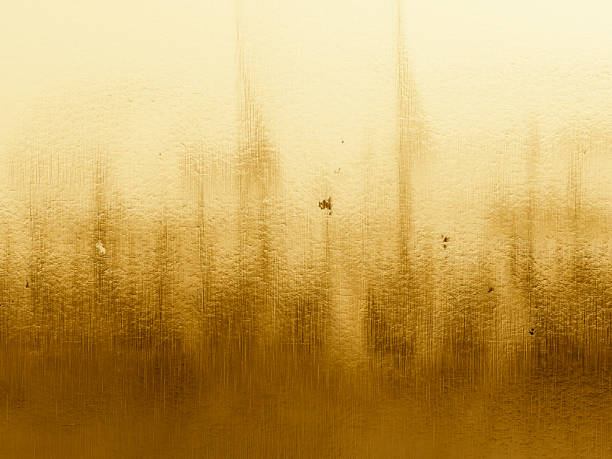 istock Glowing golden surface with a grainy texture and slight imperfections, creating depth. 2222846100