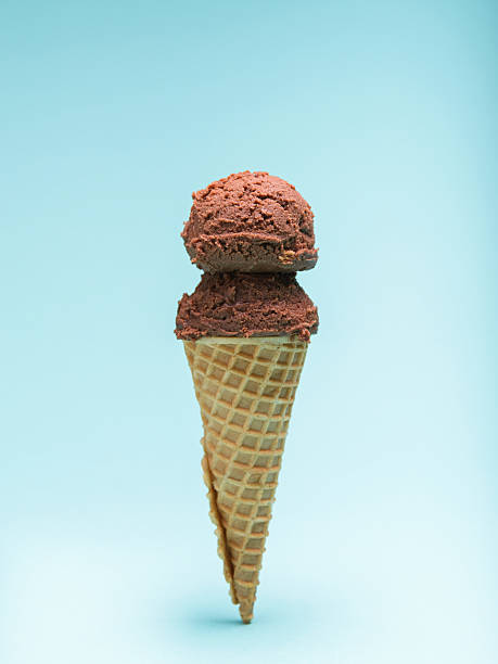 istock Chocolate Ice Cream in a Waffle Cone. Blue Background. 2222850503