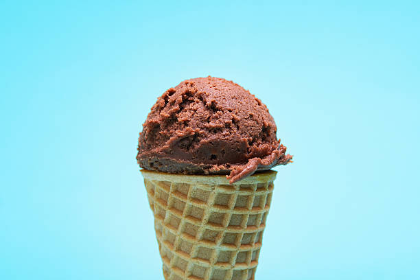 istock Chocolate Ice Cream in a Waffle Cone. Blue Background. 2222850505