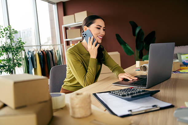 istock Young entrepreneur working on laptop in modern workspace managing online business operations 2222851209
