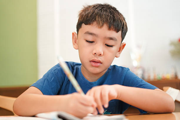 Close-up Boy doing homework at home