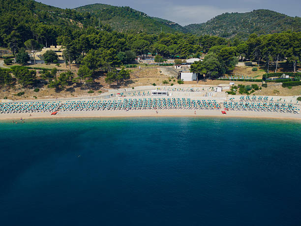 istock Italian coastline with beach umbrella rows 2222851913