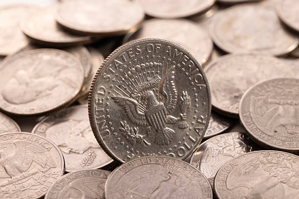 istock A stack of dollar coins stacked on each other in different positions. Money 2222852933