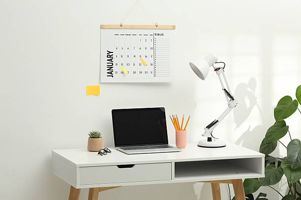 istock Desktop calendar on a modern desktop. Schedule and time planning in office and business. 2222853105