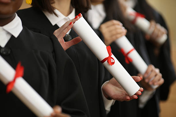 istock group of multiracial graduates holding diploma 2222853194