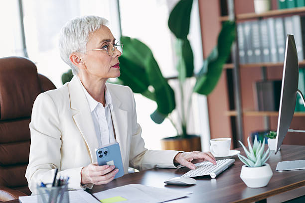 istock Mature businesswoman working confidently in modern office environment contributing innovation to corporate achievements 2222853944