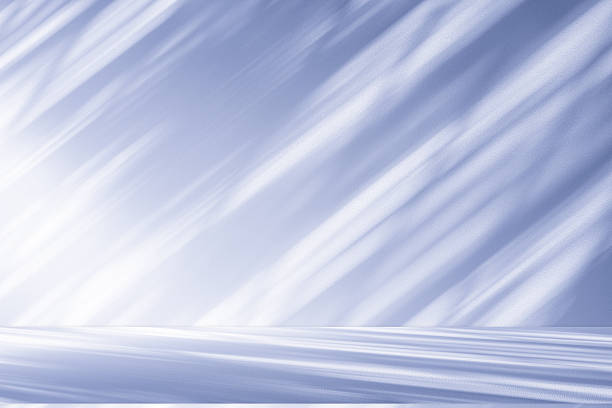 Studio style background wall decoration presentation uses white and blue tones. with shadows cast from a nearby window, concept creating a decorative