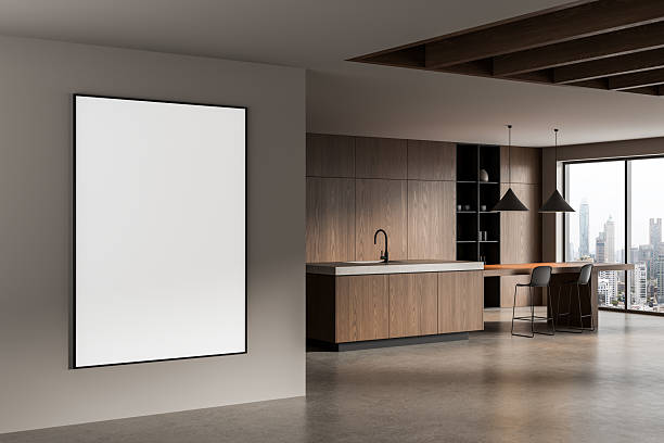 istock Interior kitchen with empty vertical poster frame on wall in modern apartment with wood details and city view through large bright window in background. 3D Rendering 2222854862