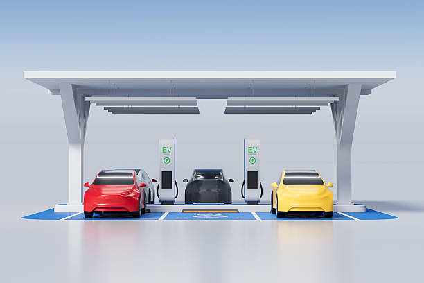 istock Electric vehicle charging station concept with multiple colorful EVs under a solar panel roof in a clean futuristic environment. 3D Rendering 2222855803