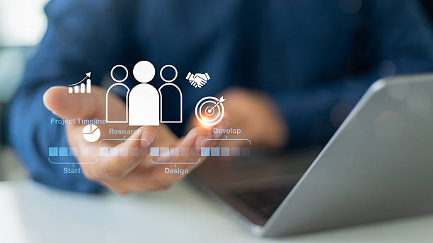 istock Businessman presenting digital interface of project timeline and human collaboration icons, representing planning, teamwork, project development, and research process. 2222859182