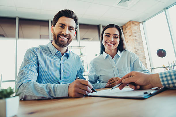 istock Professional colleagues collaborating together on business tasks in a modern office space, representing teamwork and partnership 2222859528