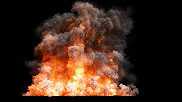 istock Isolated large explosion with a bright orange and yellow flame surrounded by thick dark smoke that rises and spreads upwards on black 2222859654