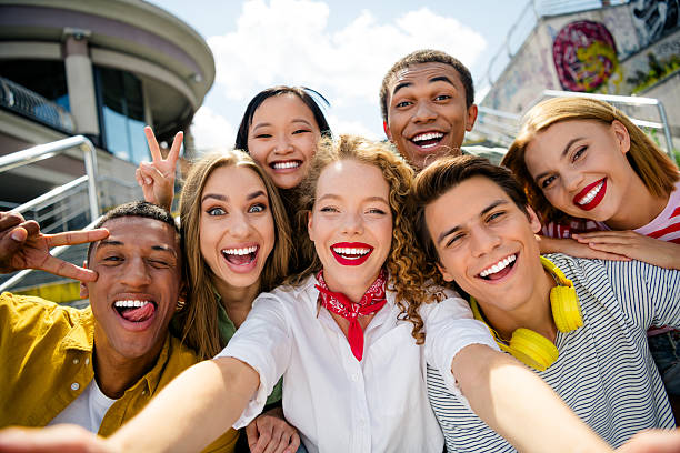 istock Buddies enjoying summer outdoors, bonding together in urban setting, showcasing youthful joy and positivity 2222859767