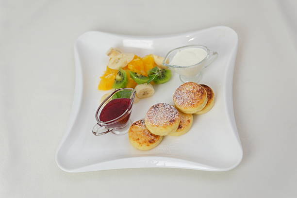 Homemade mini pancakes with blueberries, strawberries and raspberries