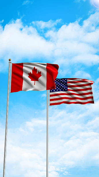 istock USA and Canada Flags Waving in the wind 2222862489
