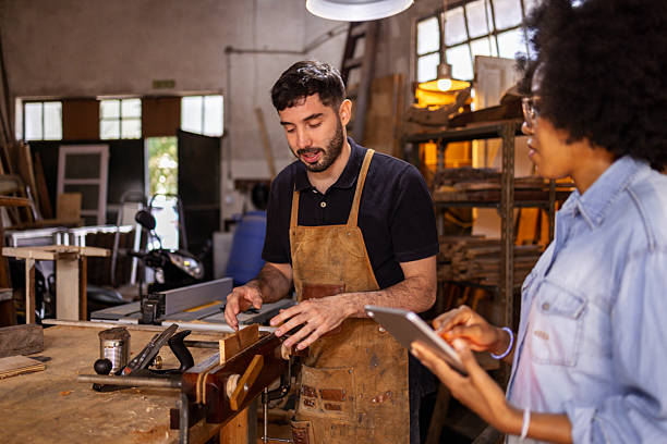 istock Collaborative effort in a sustainable woodworking workshop for crafting innovative items 2222864392