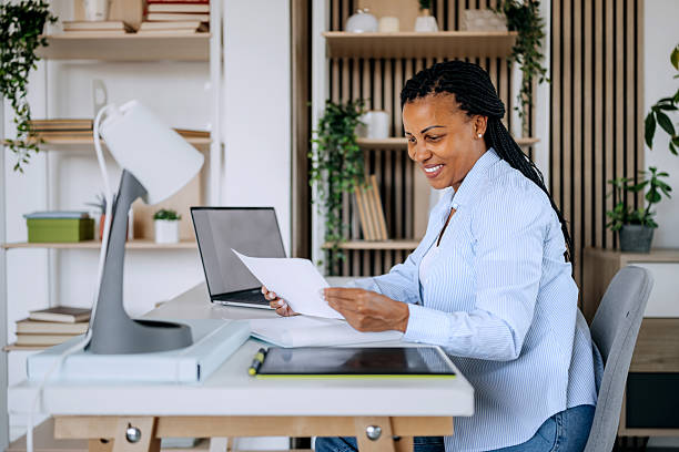 istock Woman working remotely on laptop at home 2222866367
