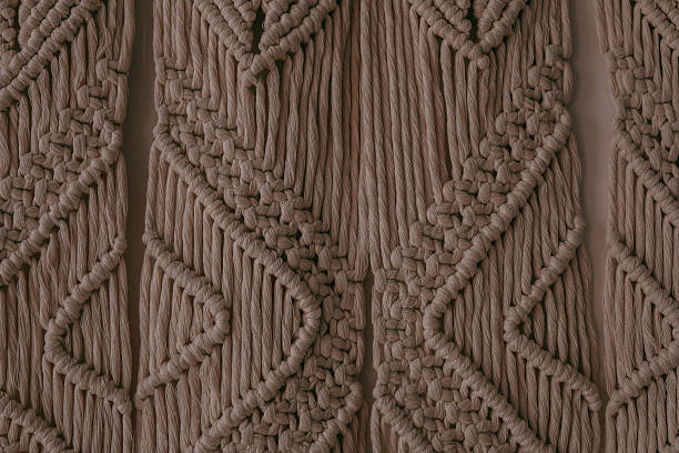Intricate macrame wall hanging showcasing detailed patterns and textures in neutral tones