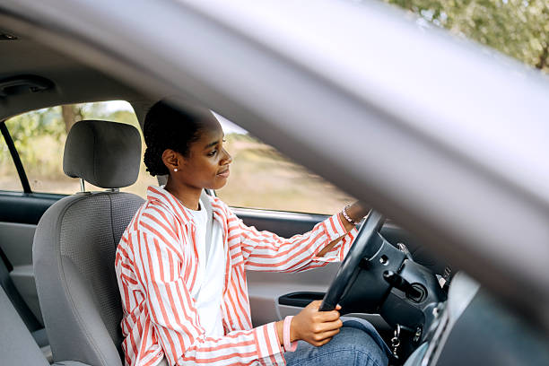 istock Casually clothed woman driving car 2222869220
