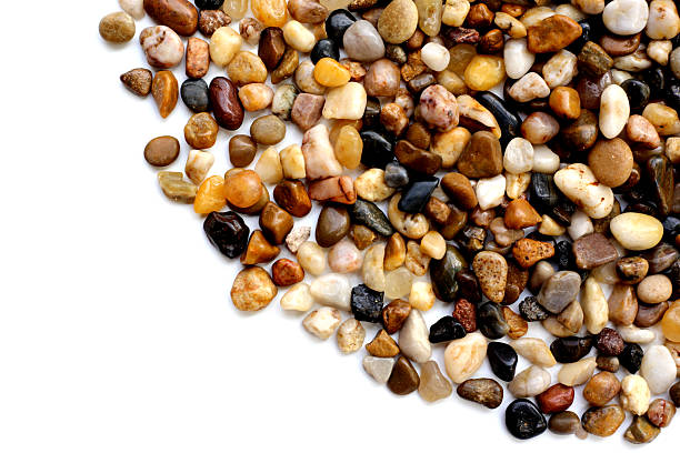 Small colorful pebbles on a white background.