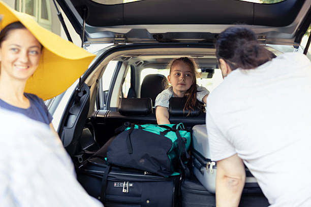 istock Open trunk and the baggage ready as large family group pack for holiday 2222877512