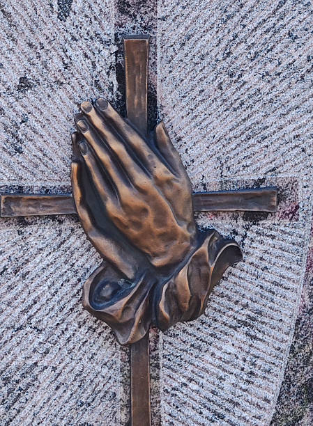 person holding hands in prayer, religious symbol of faith and devotion