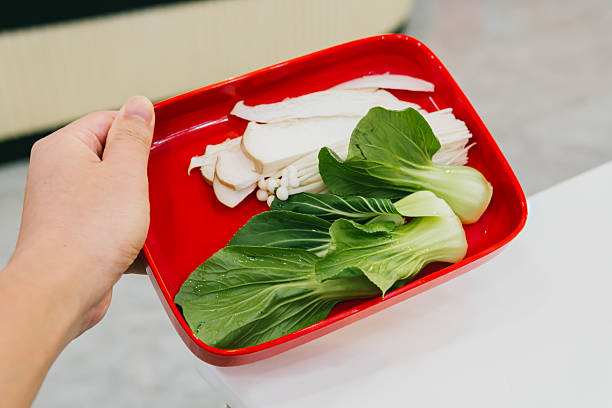Fresh Vegetables in Red Tray with Bok Choy and Mushrooms Ready for Cooking