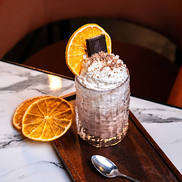 Chocolate orange milkshake with whipped cream and truffle bites