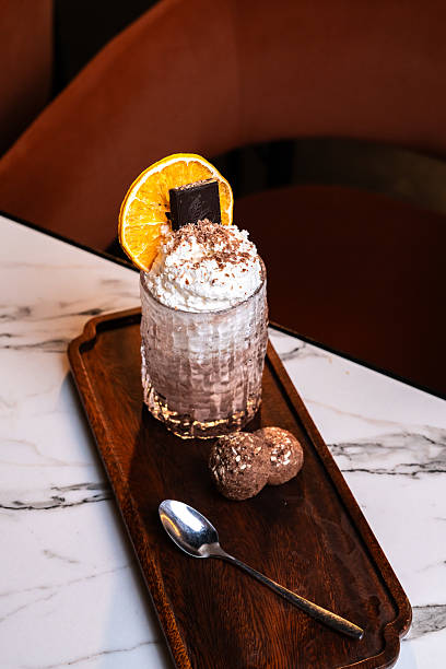 istock Chocolate orange milkshake with whipped cream and truffle bites 2222878605