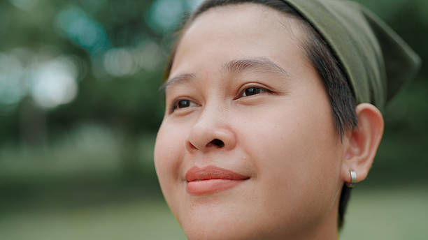 istock Asian woman looking at view in public park 2222878962