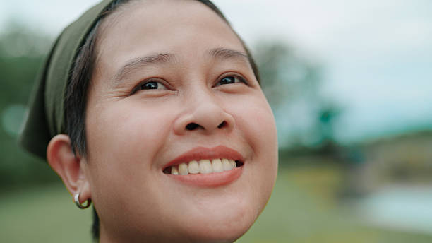 istock Asian woman looking at view in public park 2222879492