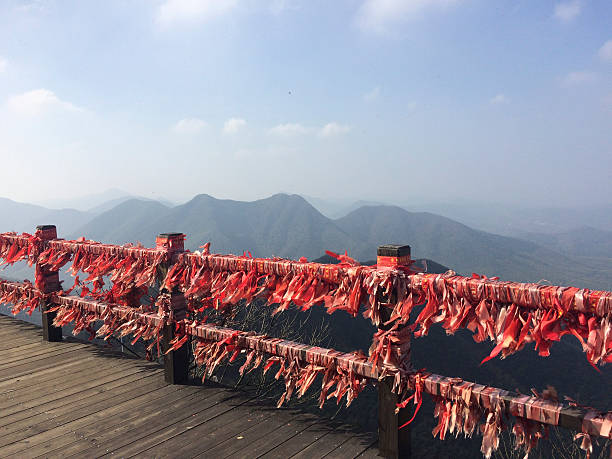 The scenery of Huashan Middle Peak,  Mt. Hua, Xi'an, province Shanxi, China. Stone monument with Chinese word: The duel on the top of Huangshan Mountain. (HuaShanLunJian 华山论剑石刻碑)