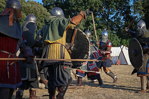 Ladispoli (RM), Italy - June 28, 2025: The Drakkar Viking Fest is a Viking historical reenactment. Group of Viking warriors wearing armor face each other in a simulated combat, in the style of Norse culture. Historical reenactment.