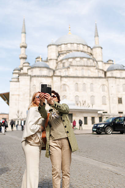 istock Female friends taking selfie on mobile phone while sightseeing Istanbul during sunny day 2222881613