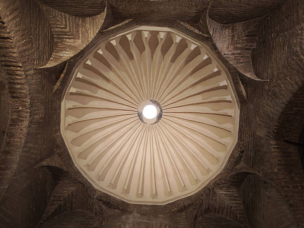 The elegant ribbed dome of Santa Marina's chapel features a luminous oculus, creating a stunning focal point in this sacred space.