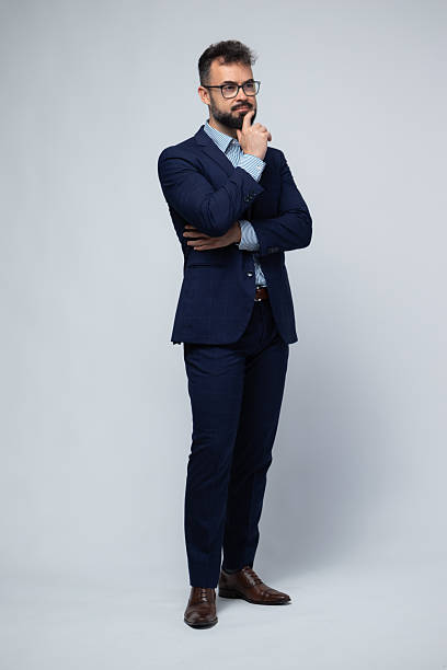 istock Thoughtful Spanish Businessman in Blue Suit Looking Away 2222882175