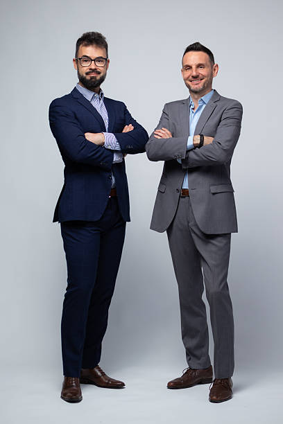 istock Two Professional Men Standing with Arms Crossed and Confident Smiles 2222882189