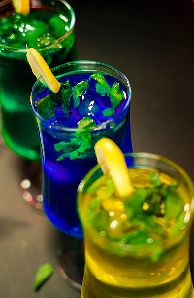 istock Vibrant Mint Cocktails: Blue, Green, Yellow Refreshing Drinks 2222882597