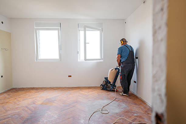 istock Mature Worker Sanding A Parquet Floor In An Empty Apartment Under Renovation 2222885569