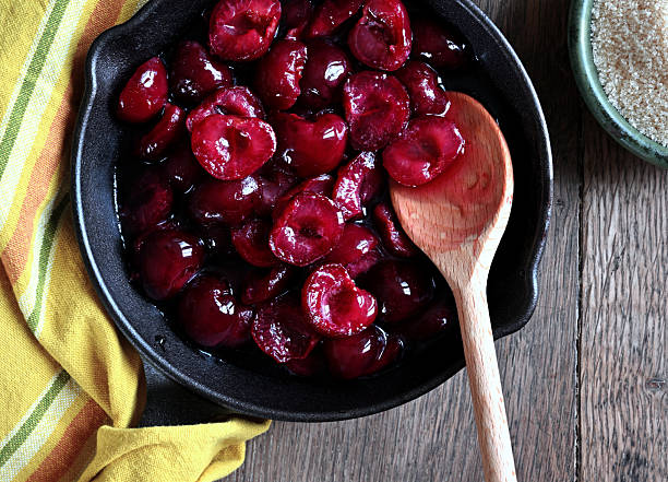 istock Candied cherries in a cast-iron pan 2222887262