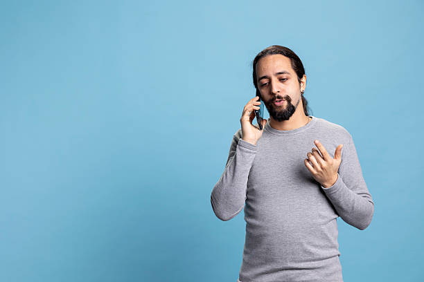 istock Middle eastern guy chatting on a phone call with a friend 2222888409